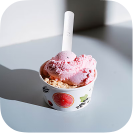 A cup of strawberry ice cream